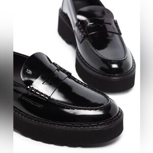 Tod’s penny-slot patent leather loafer